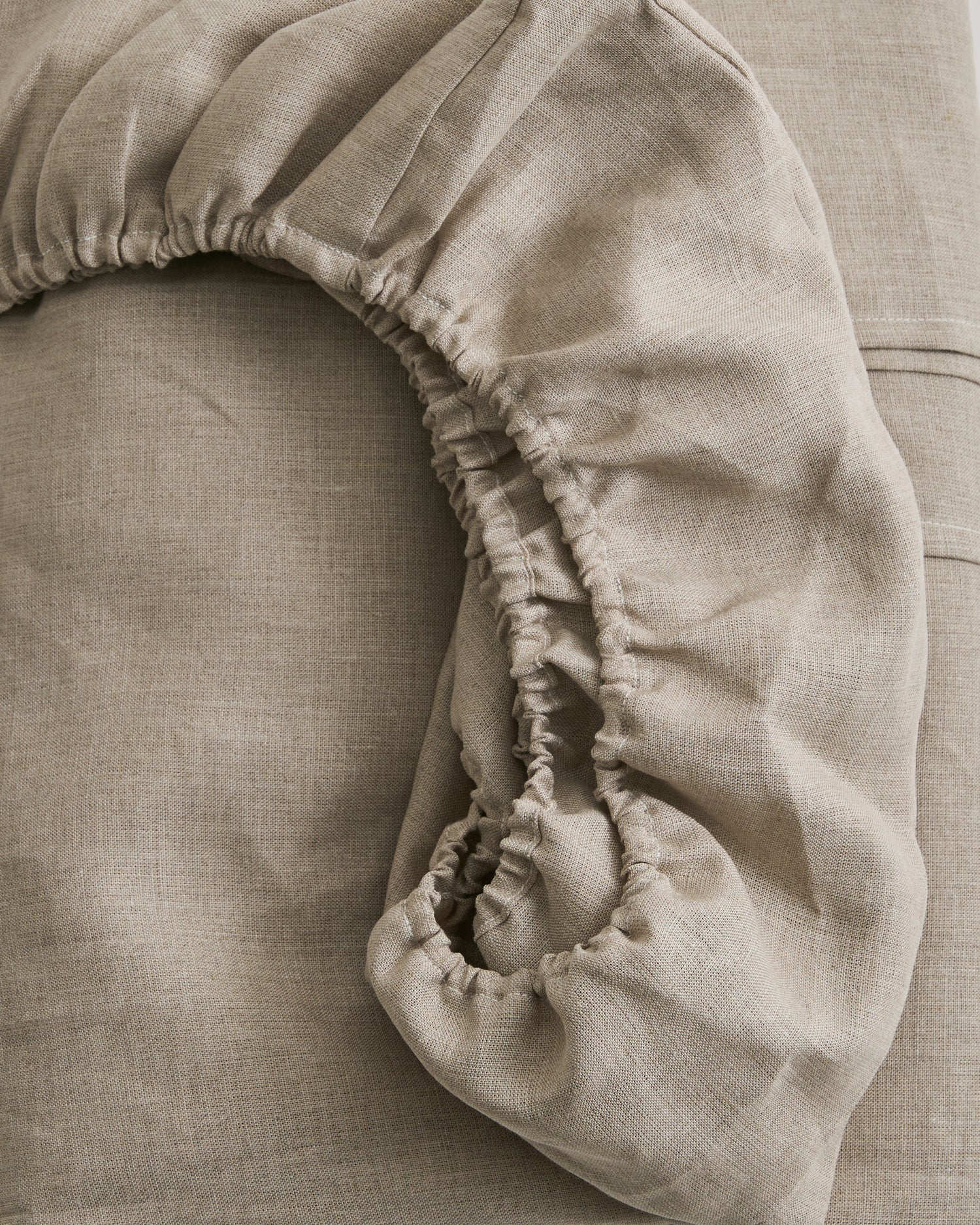 Close-up of a unbleached linen fitted sheet by iwata 