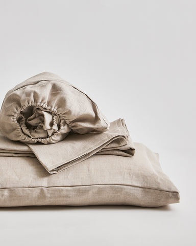 Up-close of Unbleached Linen Sheet Set by Iwata on a gray background