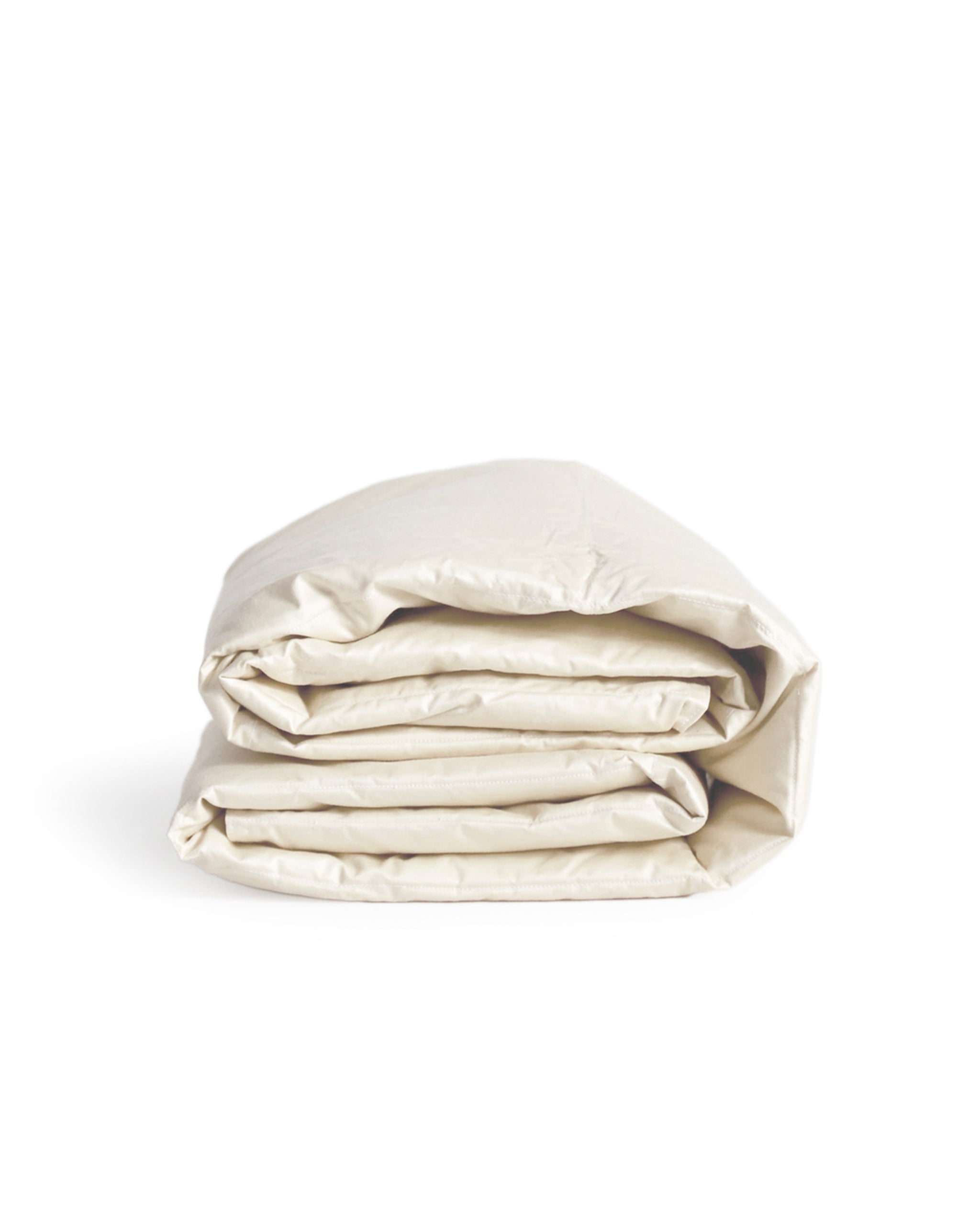 Folded beige down feather shawl by Iwata on a white background