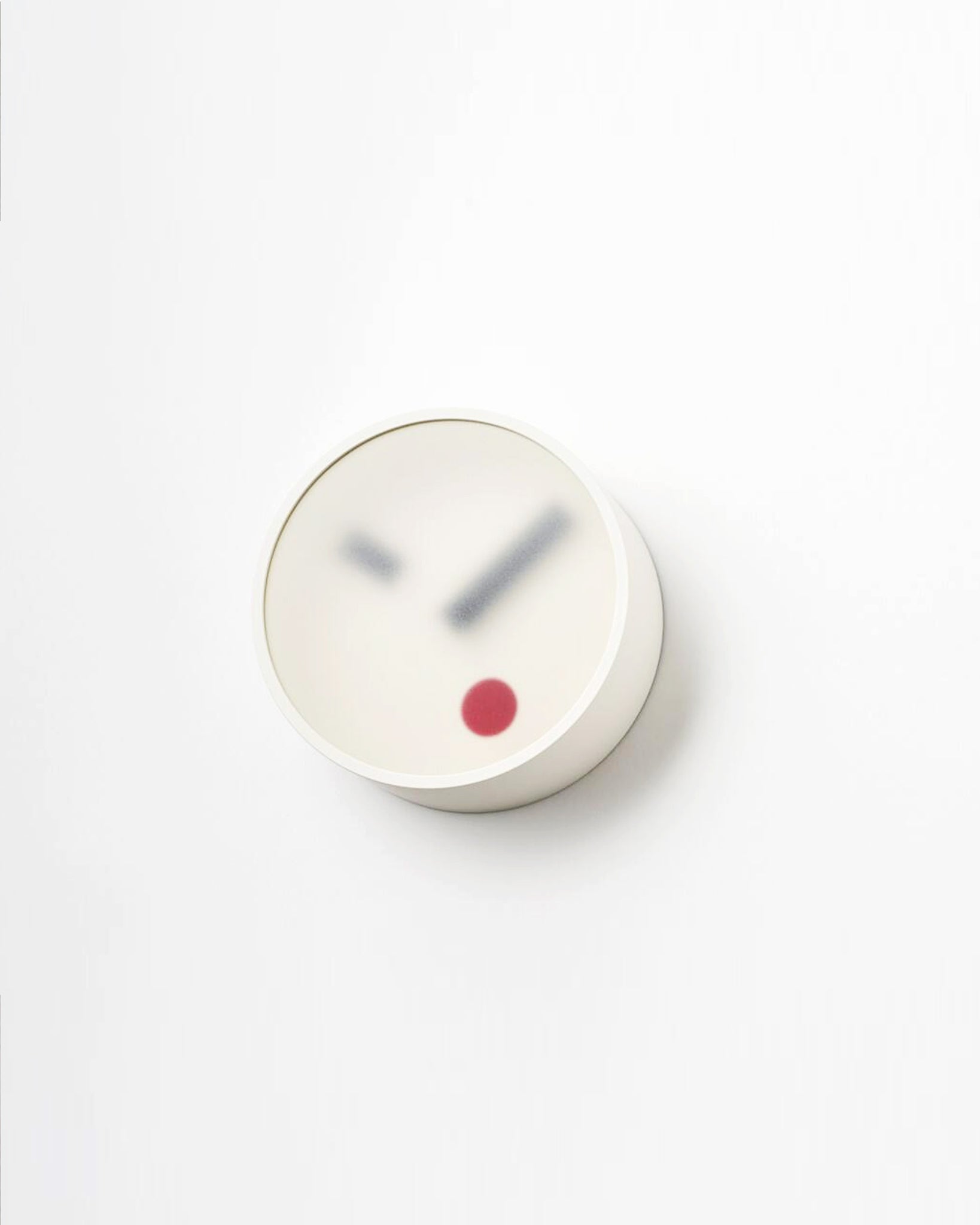 Angled side view of White Kehai Clock by Koizumi studio against white-gray background.