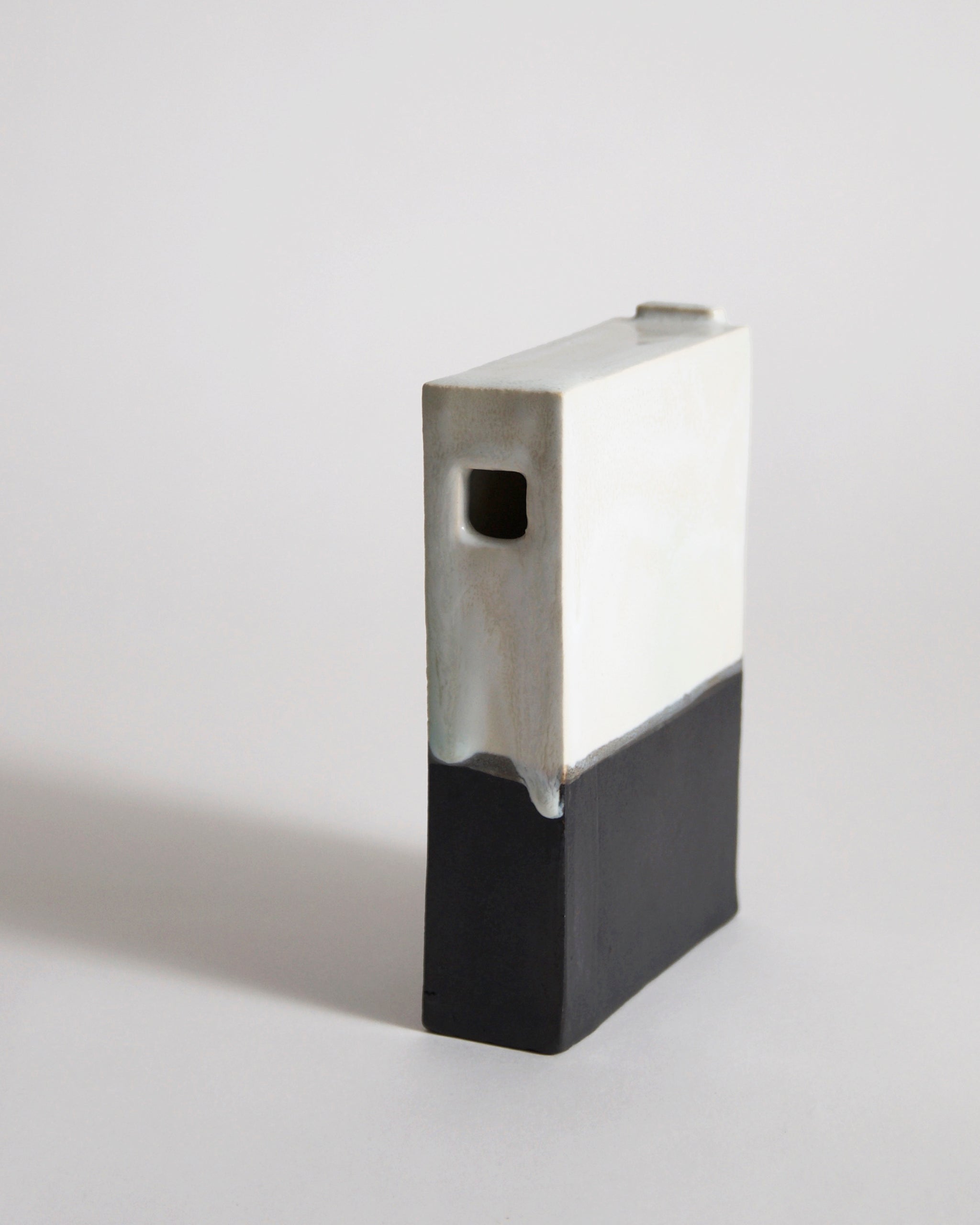 Black and White Hanging Vase by Masanobu Ando on a gray background