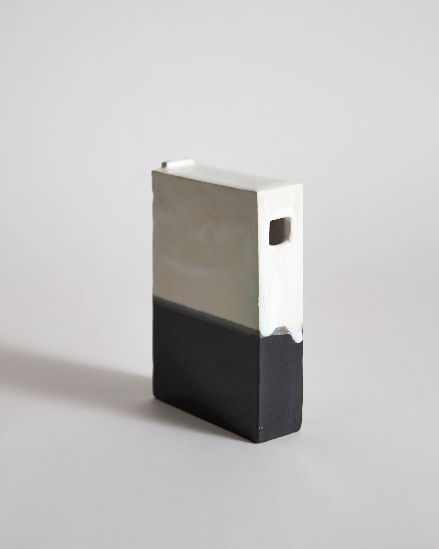 Black and White Hanging Vase by Masanobu Ando on a gray background