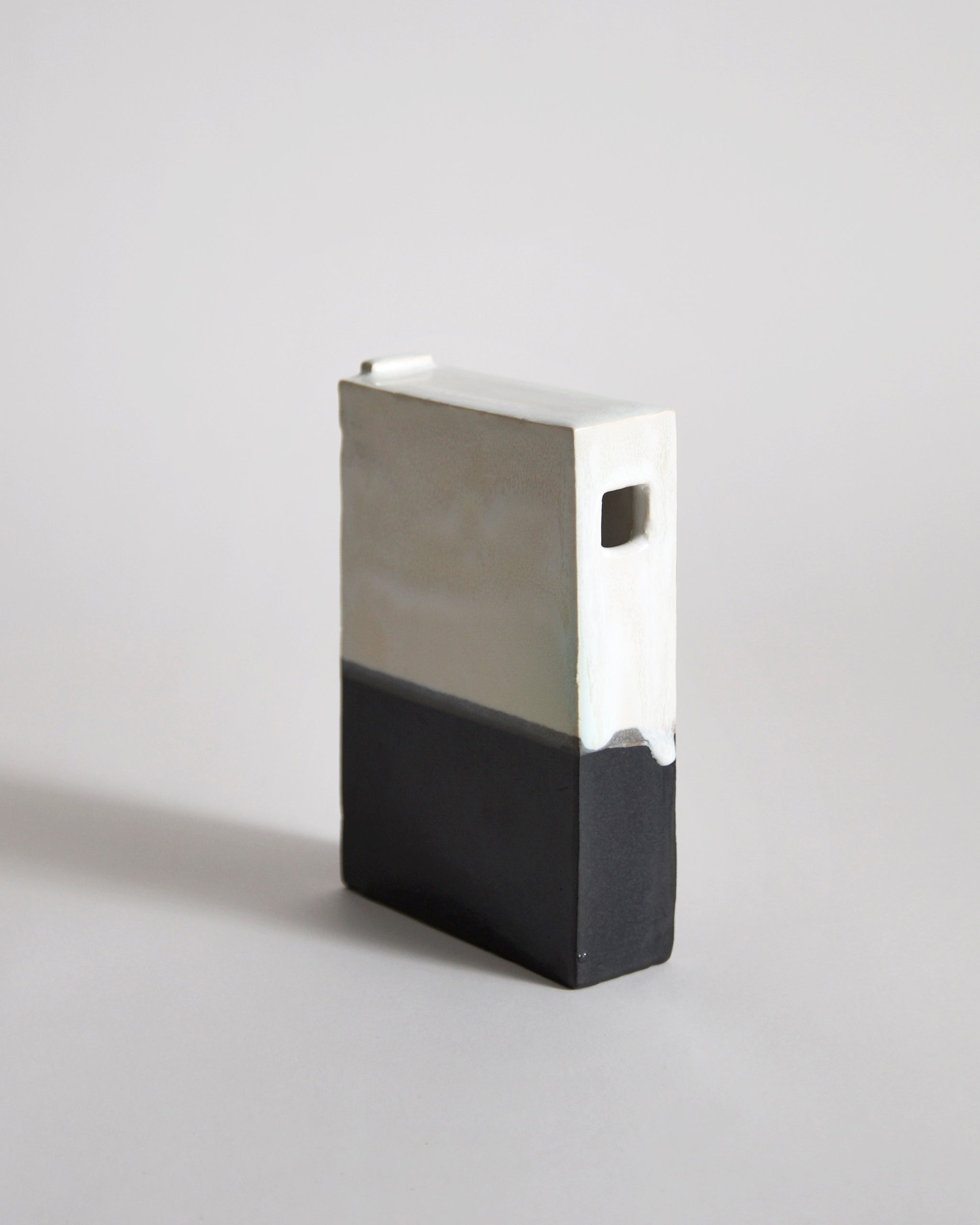 Black and White Hanging Vase by Masanobu Ando on a gray background