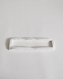 white ceramic boundary sculpture by Masanobu Ando on a gray background