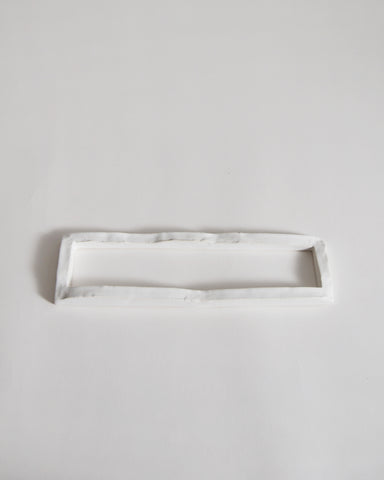 white ceramic boundary sculpture by Masanobu Ando on a gray background