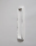 White ceramic boundary sculpture by Masanobu Ando on a gray 