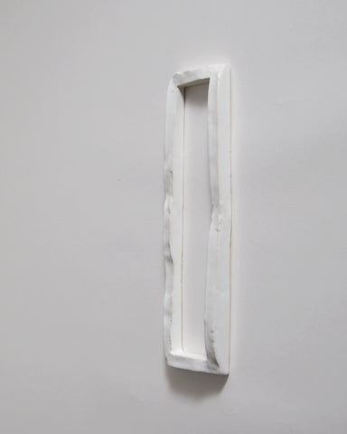 White ceramic boundary sculpture by Masanobu Ando on a gray 