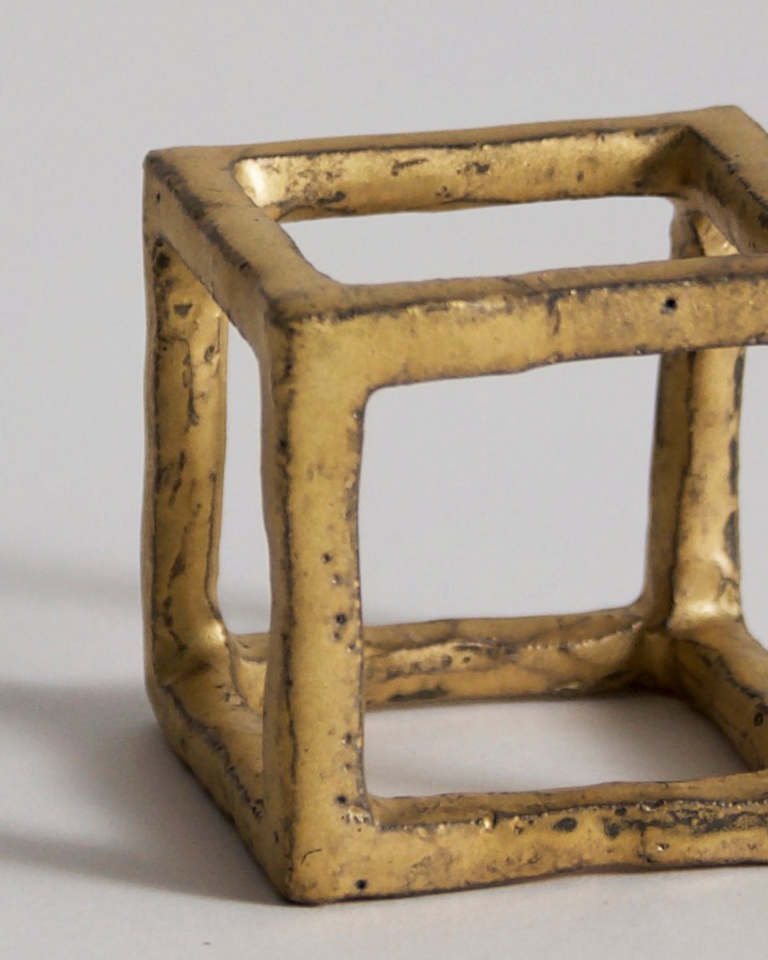 Up-close of Gold Box of Air by Masanobu Ando on a gray background