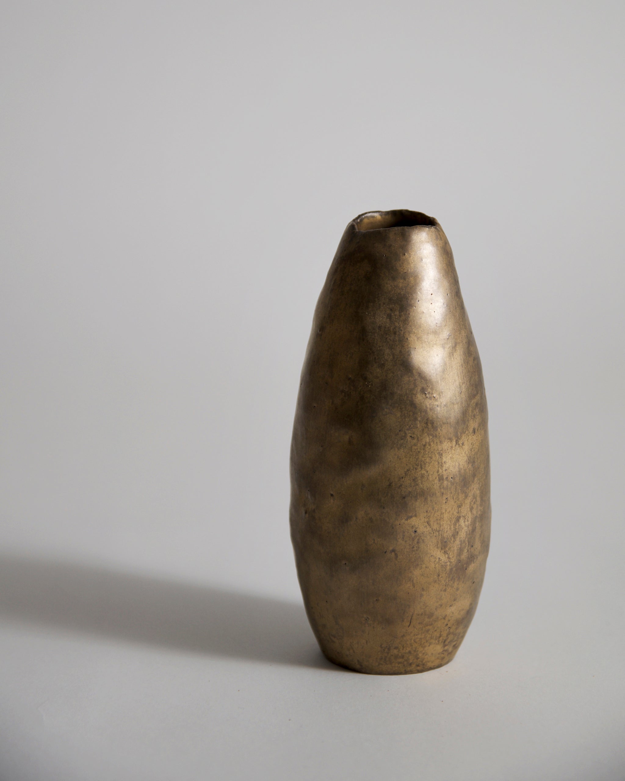 Gold Vase by Masanobu Ando on a gray background