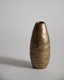 Gold Vase by Masanobu Ando on a gray background