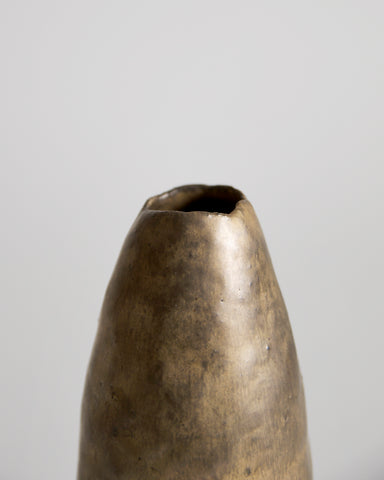 Up-close of top of Gold Vase by Masanobu Ando on a gray background