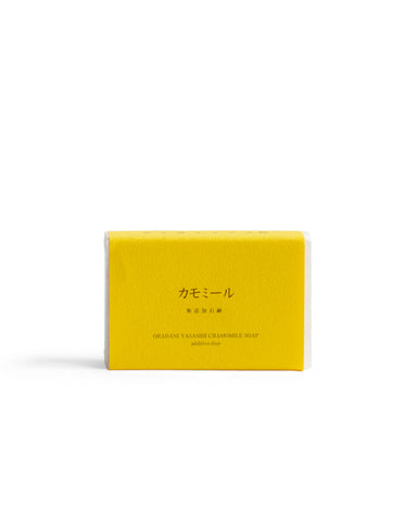 Chamomile Mutenka Sekken soap against a white backdrop. Packaging in a deep yellow.