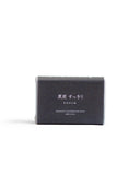 Sumi Charcoal Mutenka Sekken soap against a white backdrop. Packaging in a dark grey almost black.