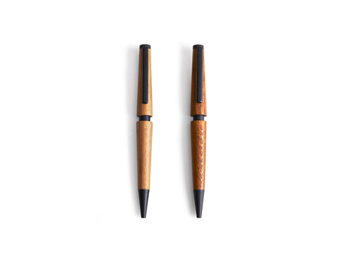 Two wooden pens by Nalata Nalata on a white background