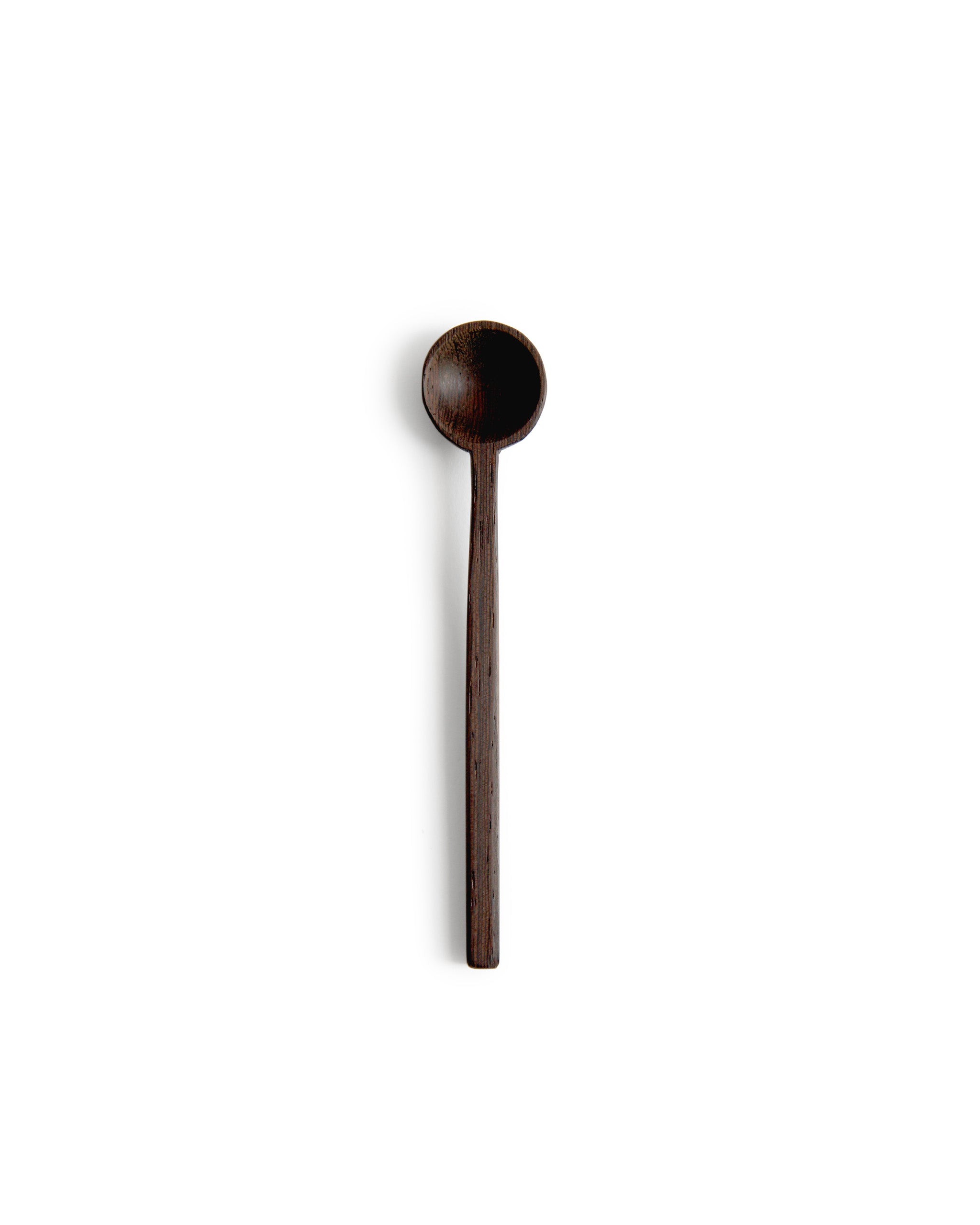 Silhouetted image of hand carved tagaya wood spoon by Nalata Nalata against white background.
