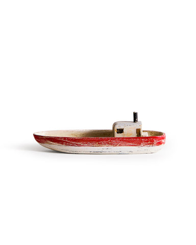 Small wooden boat with red,gray, and black paint by Ryuji Mitani on a white background