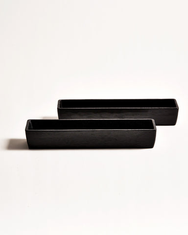 Front view of 2 staggered Chopsticks Holders by Ryuji Mitani against white-gray background.