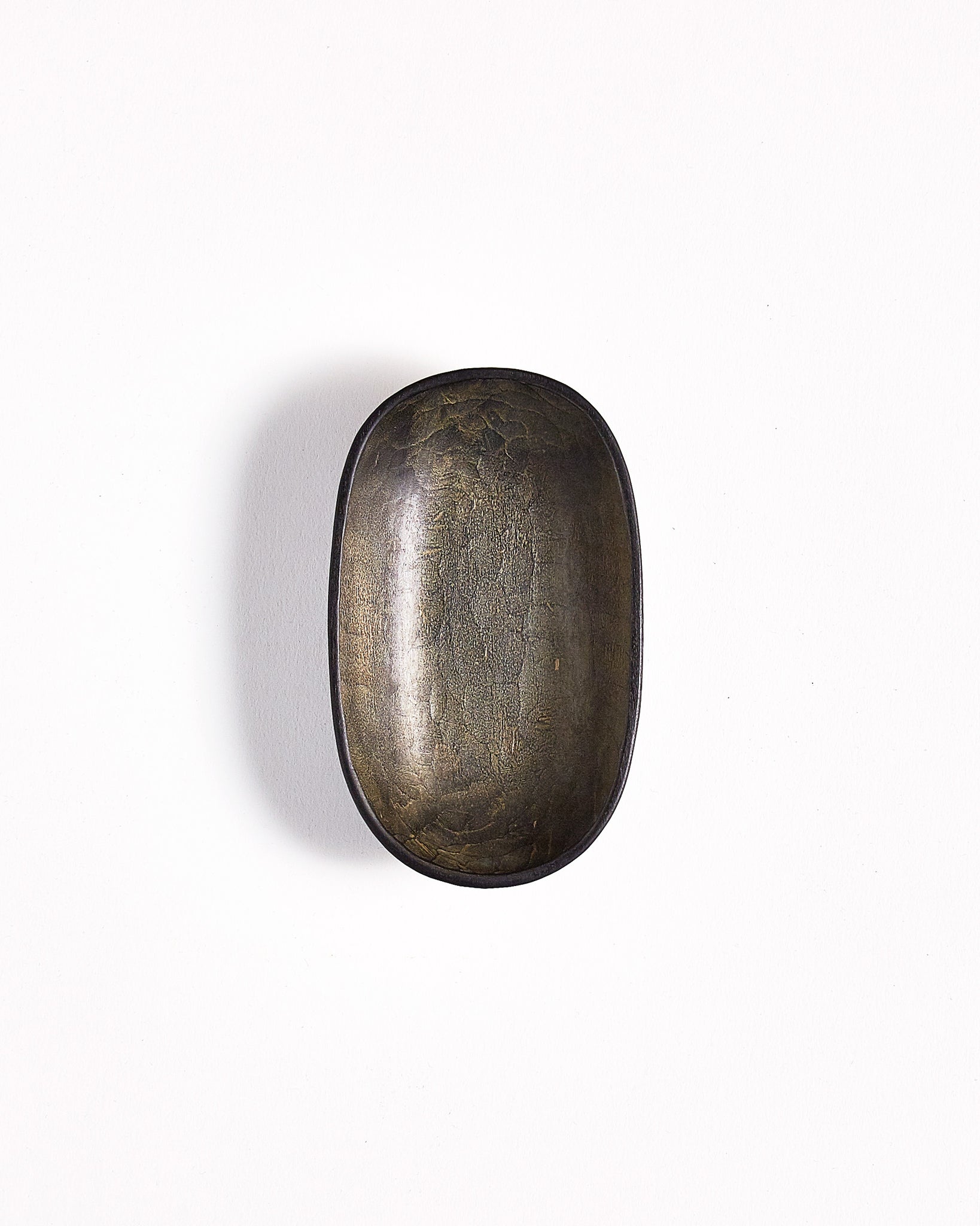 Top vertical view of Small Shallow Usuzumi Oval Bowl by Ryuji Mitani against white background. Variation of brushstroke.