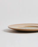 Cropped view of large White Urushi Plate by Ryuji Mitani against white-gray background. 