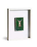 Framed artwork of a person in a dress with arms outstretched in a Y-shape on a green background