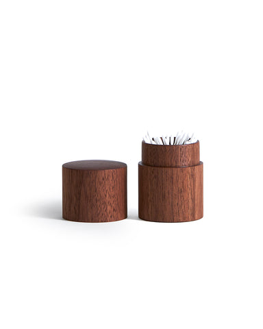 Wooden container with lid holding q-tips on a white background
