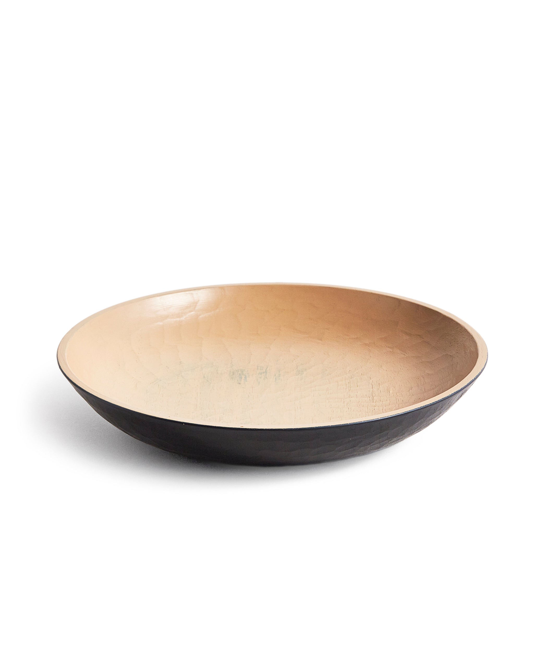 Wooden bowl with beige interior and a black exterior by Ryuji Mitani on a white background