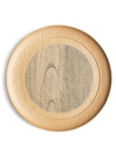 Round beige wooden plate with a gray circle center by Ryuji Mitani on a white background