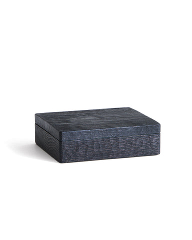 Black rectangular wooden box by Ryuji Mitani on a white background