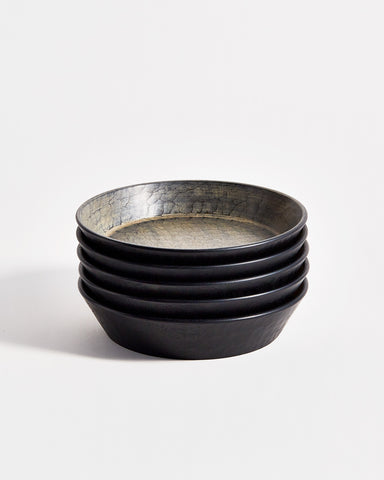 Front view of 5 stacked Hakuboku Serving Bowls by Ryuji Mitani against white-gray background. 