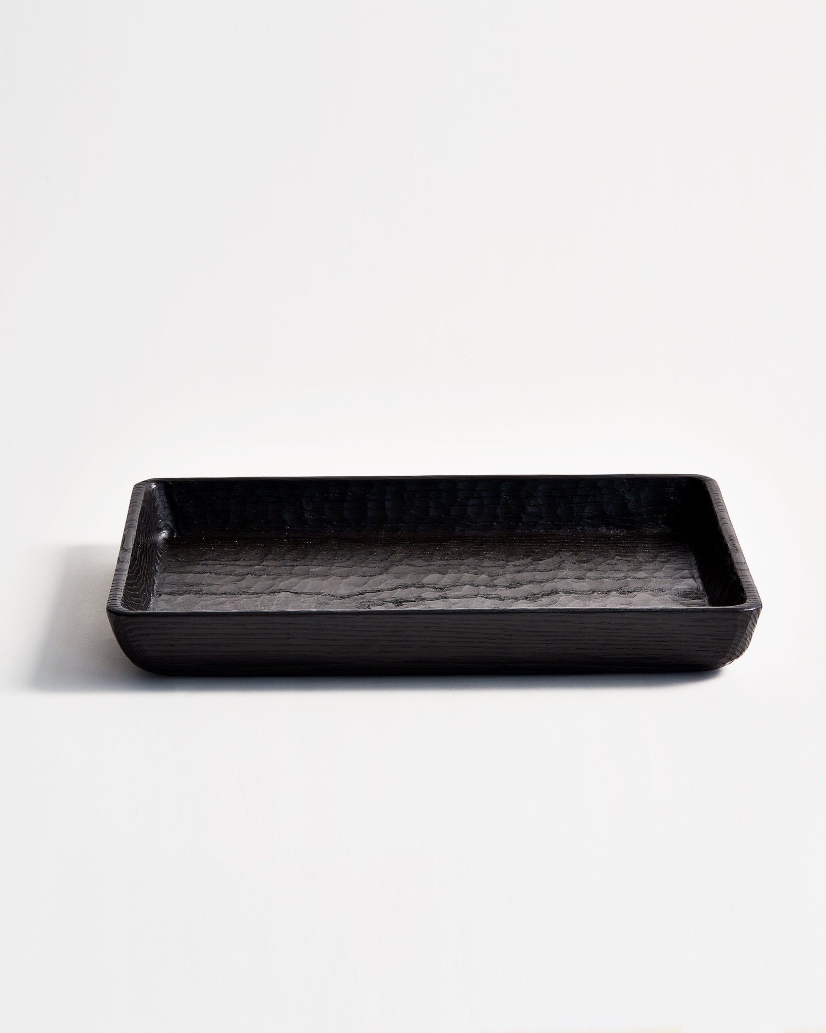 Front view of Noir Chestnut Wood Vat by Ryuji Mitani against white-gray background.