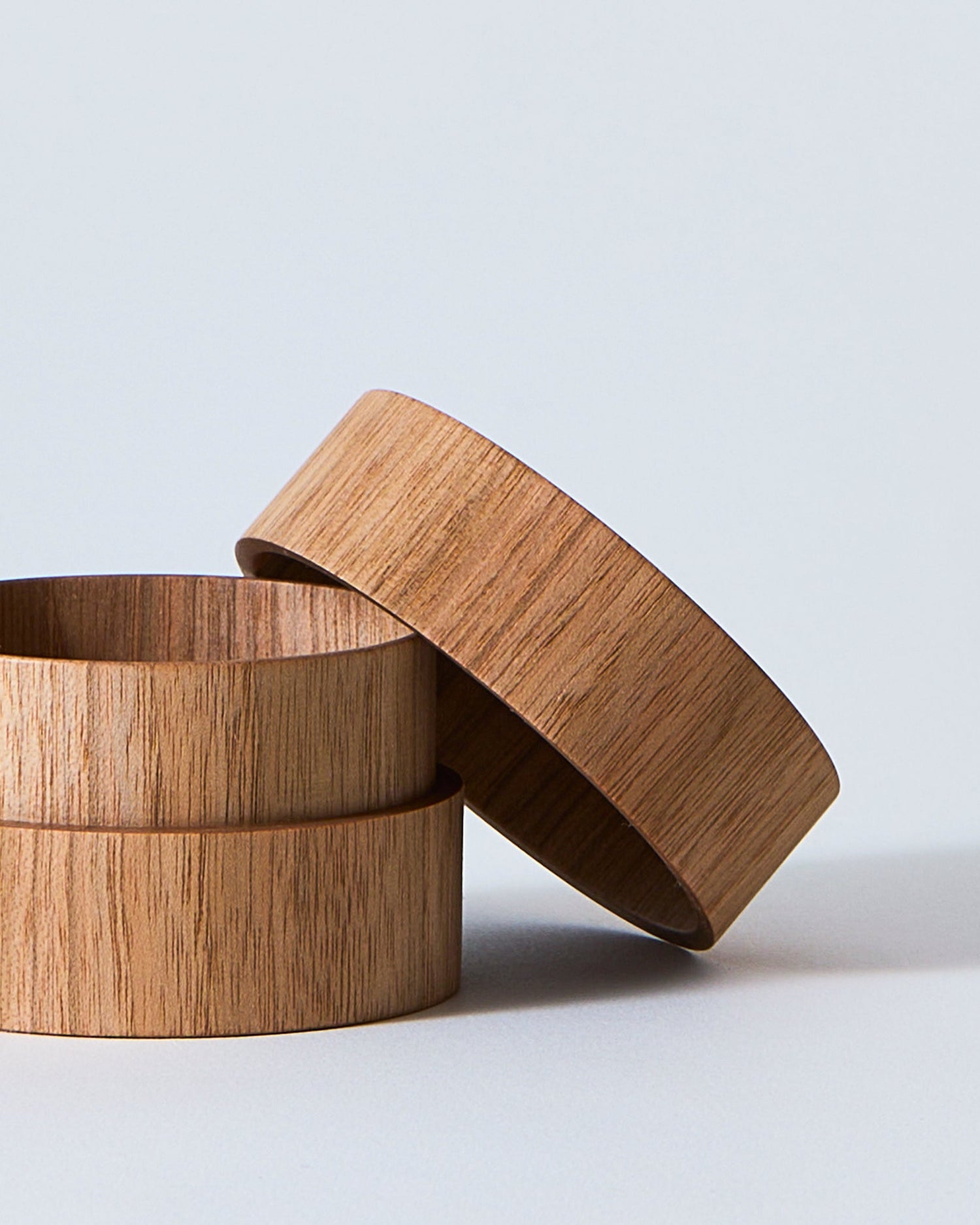 Open wooden tea case with lid propped on side by Ryuji Mitani on a gray background