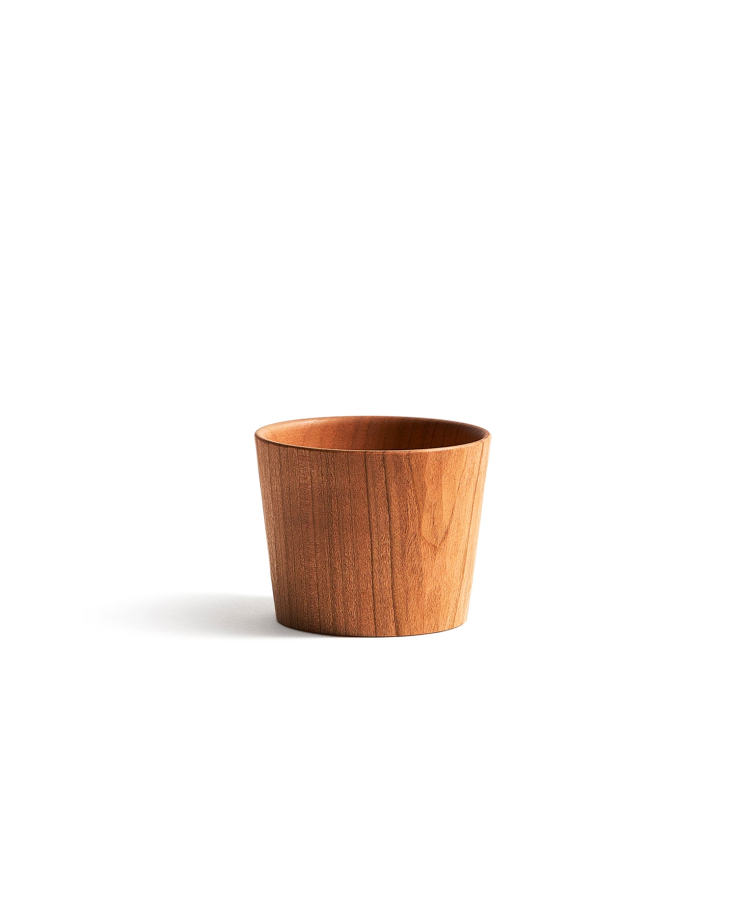 Wooden cup by Ryuji Mitani on a white background