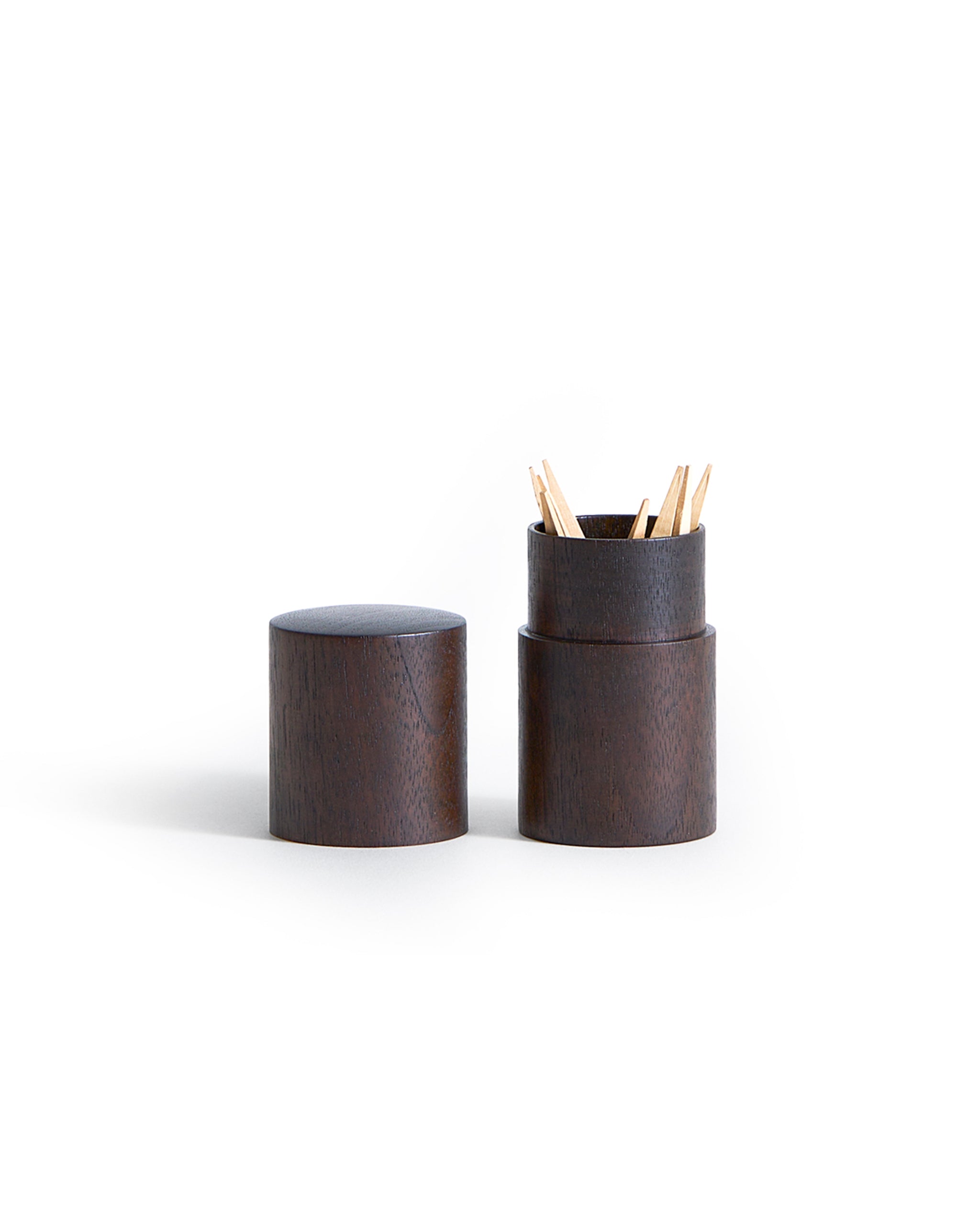 Open black walnut toothpick container holding toothpicks by Ryuji Mitani on a white background