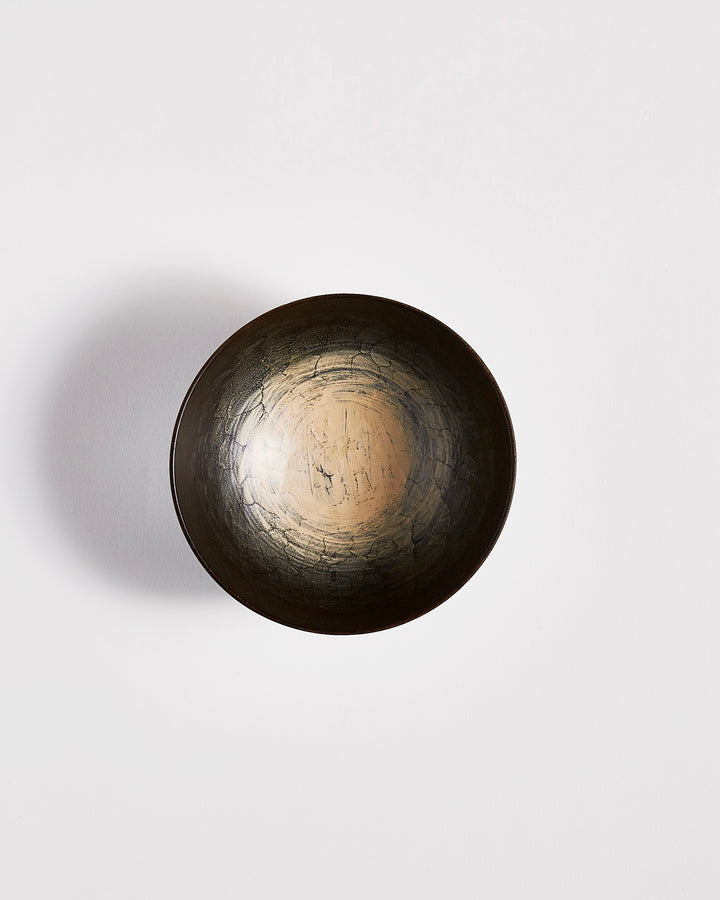 Top view of Usuzumi Black Walnut Bowl by Ryuji Mitani against white-gray background. Variation of brushstroke. 