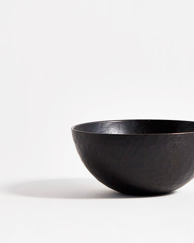Partial front view of Usuzumi Black Walnut Bowl by Ryuji Mitani against white-gray background.