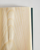 Up-close of open notebook by Shiki-bun on a light gray background