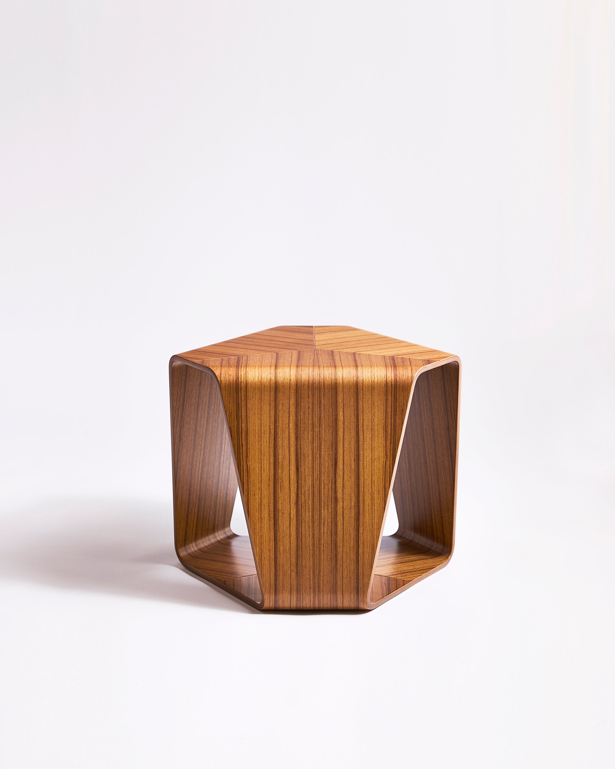 Wooden stool by Tendo Mokko on a gray background