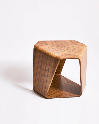 Wooden stool with geometric design by Tendo Mokko on a gray background