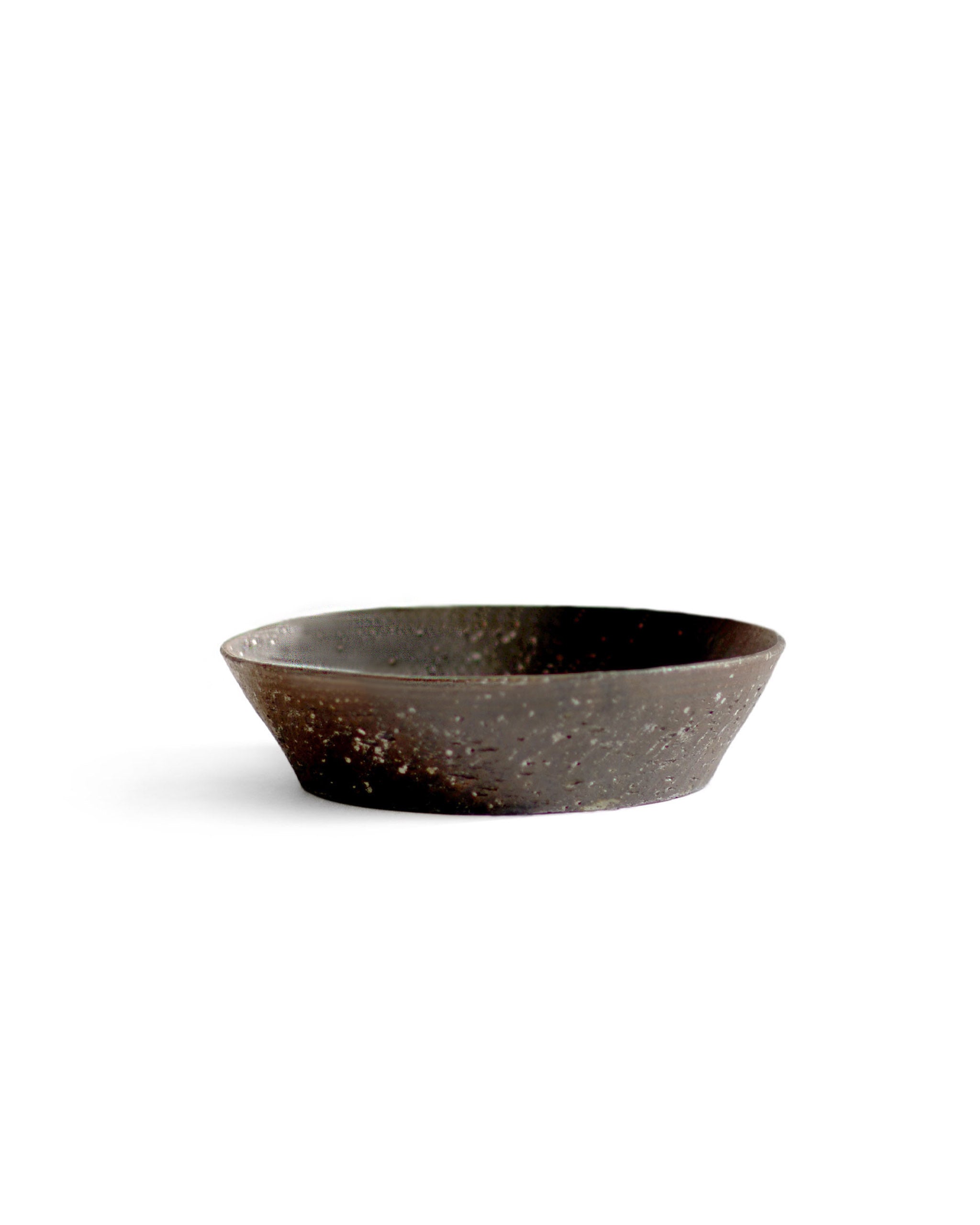 A brown textured bowl against white background.