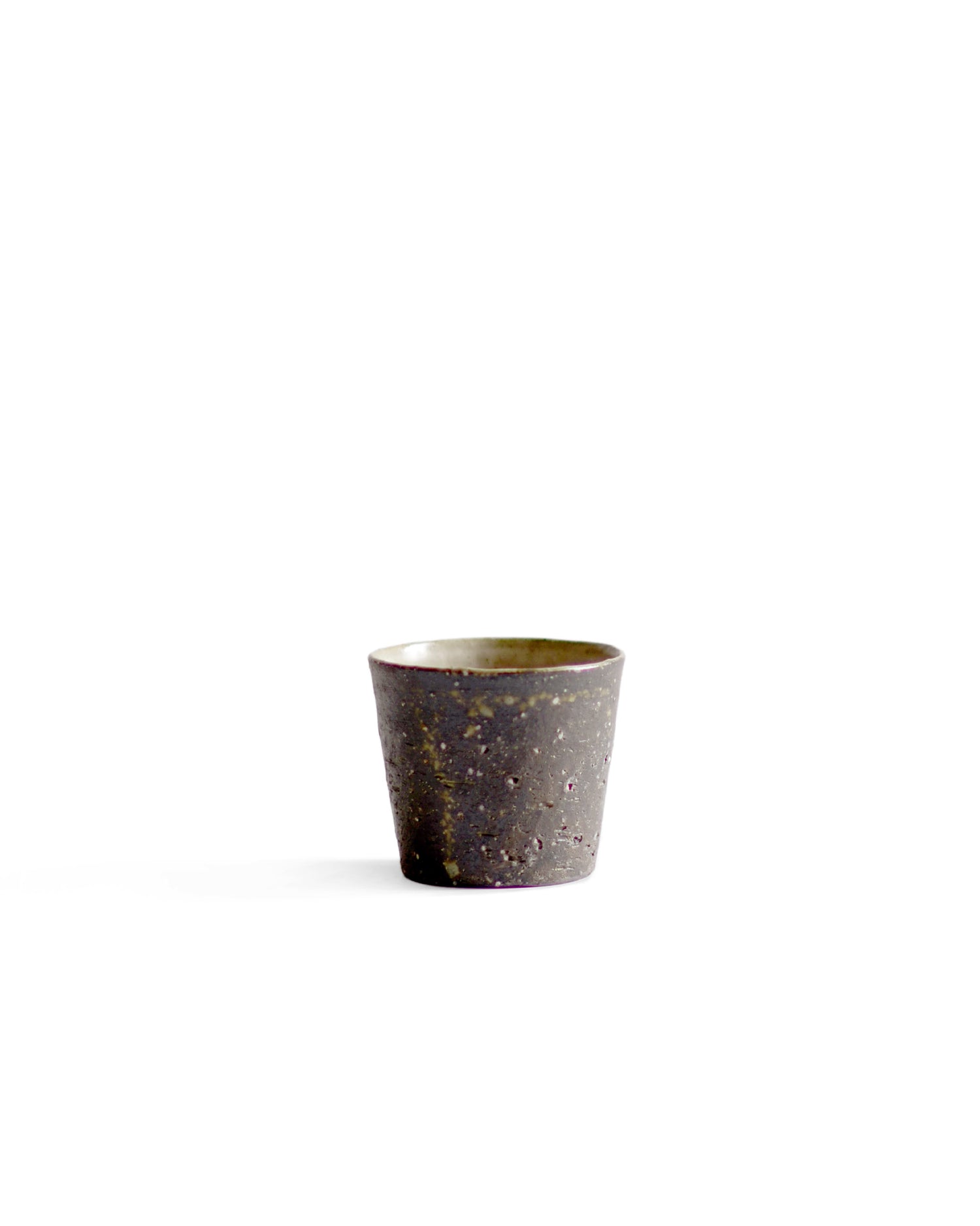 A brown textured cup against white background.