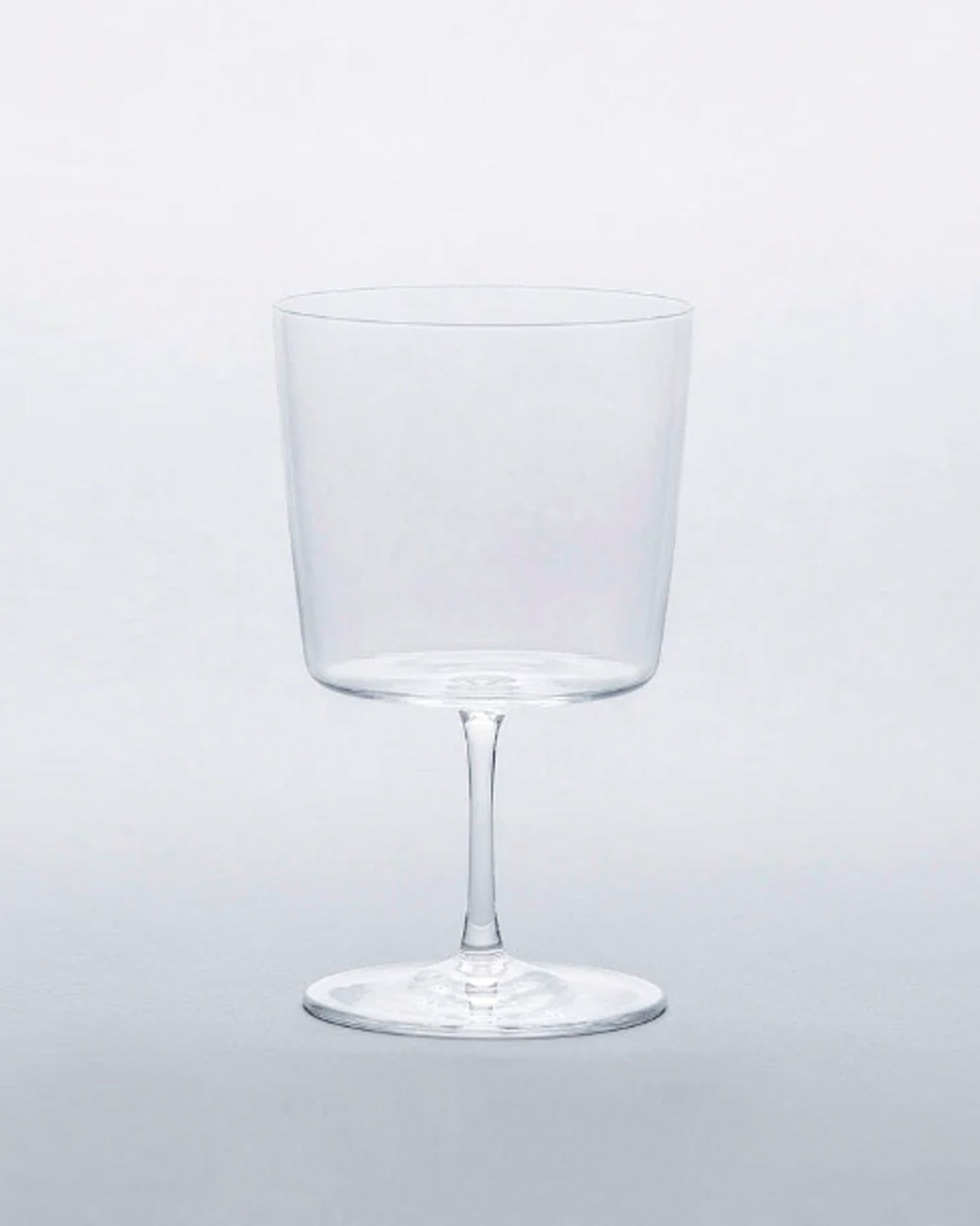 Time and style raisin glass against gray background.