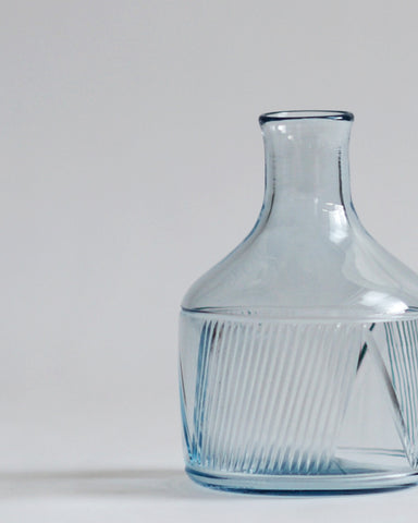 Detailed view of the factory zoomer reclaimed blue carafe focusing on the specialty cut glass pattern. 