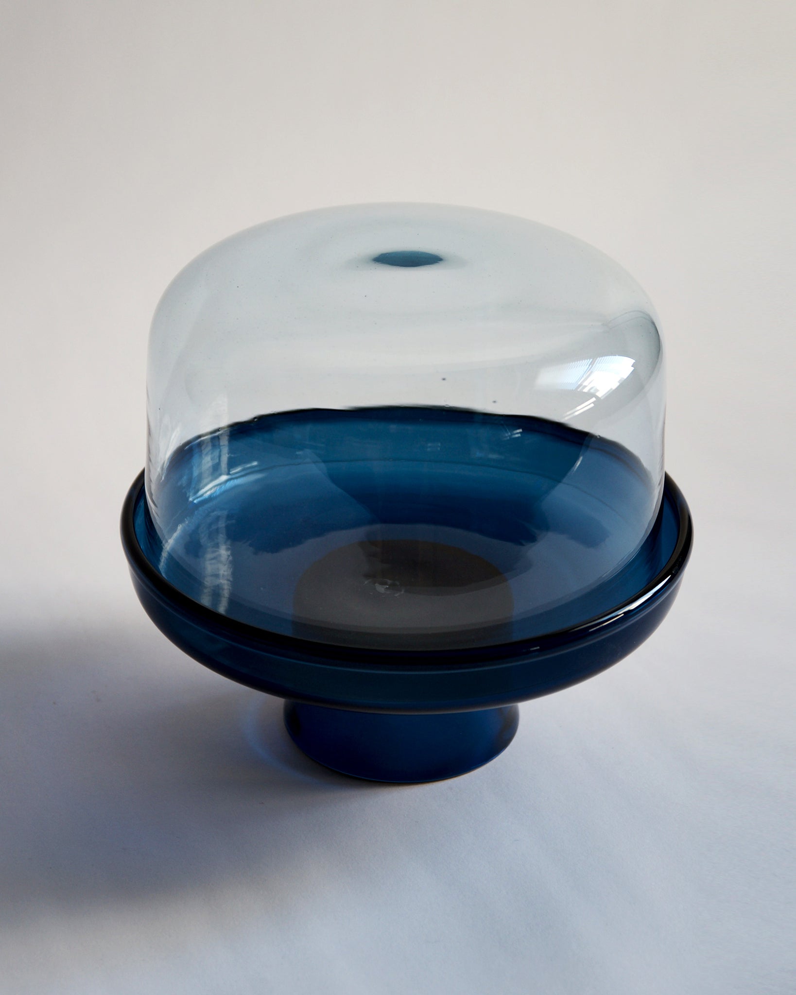 Top view of the reclaimed blue comport and dome. Comport is dark blue and dome is light clear blue.