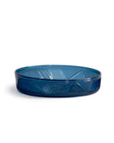 Silhouetted dark blue reclaimed blue schale against white background.