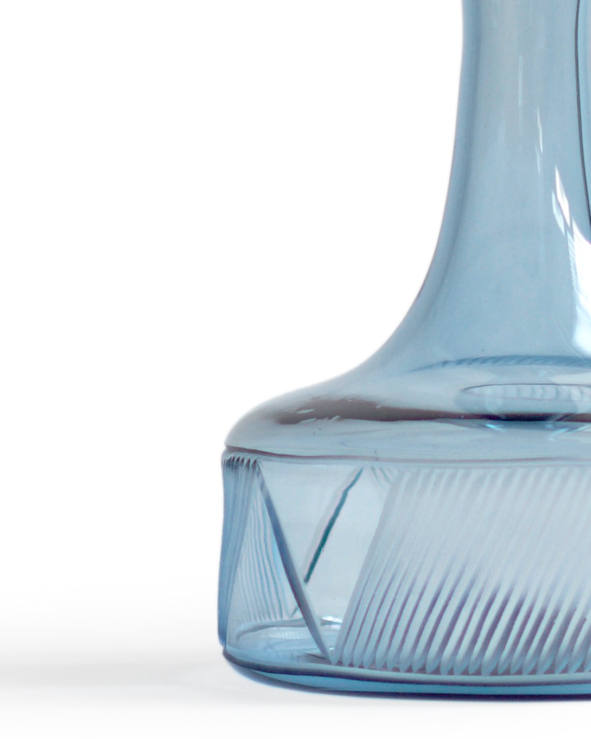 Cropped detail of the body of the reclaimed blue whiskey decanter. Slash pattern from N and Z are visible.