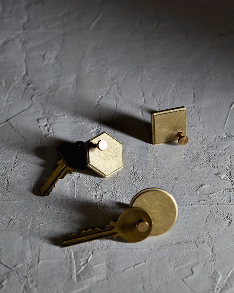 Diamond Plate, Circle Plate, and Hexagon Plate Key Rings by Futagami on a textured white surface
