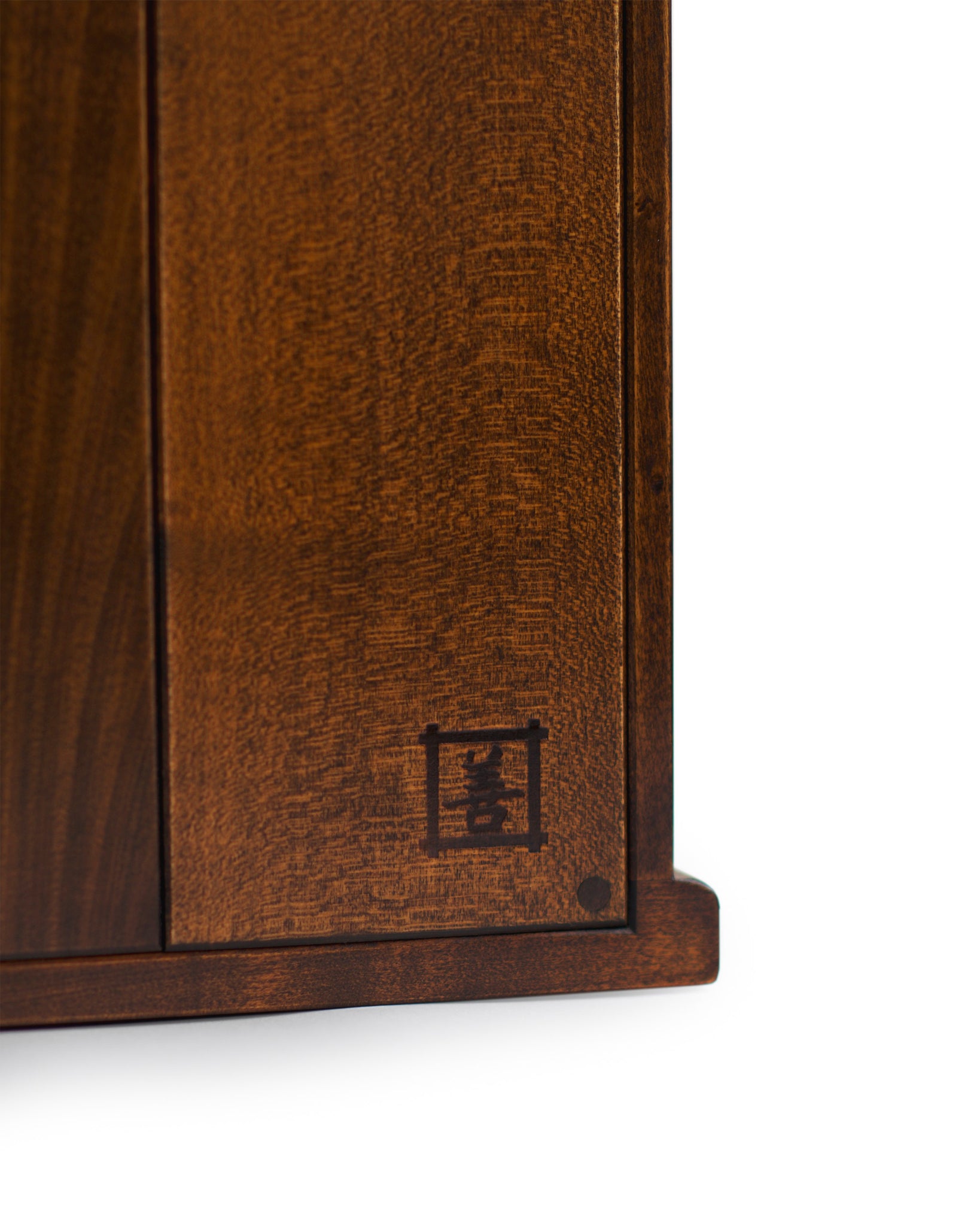 Detailed image of the ibazen signature marked on the lower back right corner of the tabletop glass vitrine.