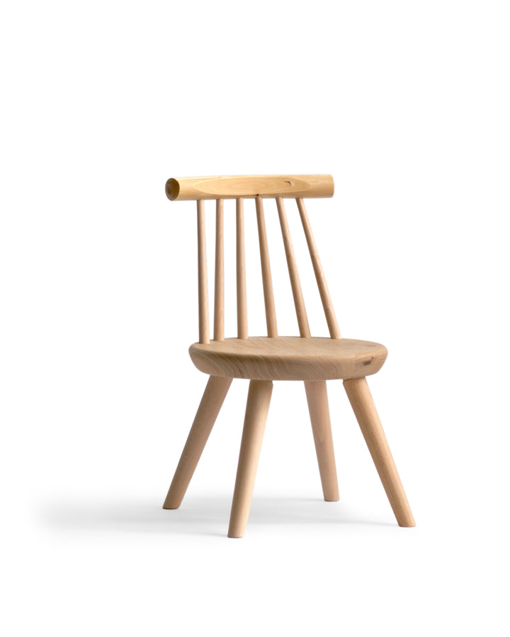 Silhouetted image of the Kinoe Kids Chair against a white background at an angle.