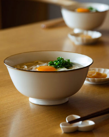 Porcelain white with brown rim Noodle Bowl by Jicon in table setting with ramen