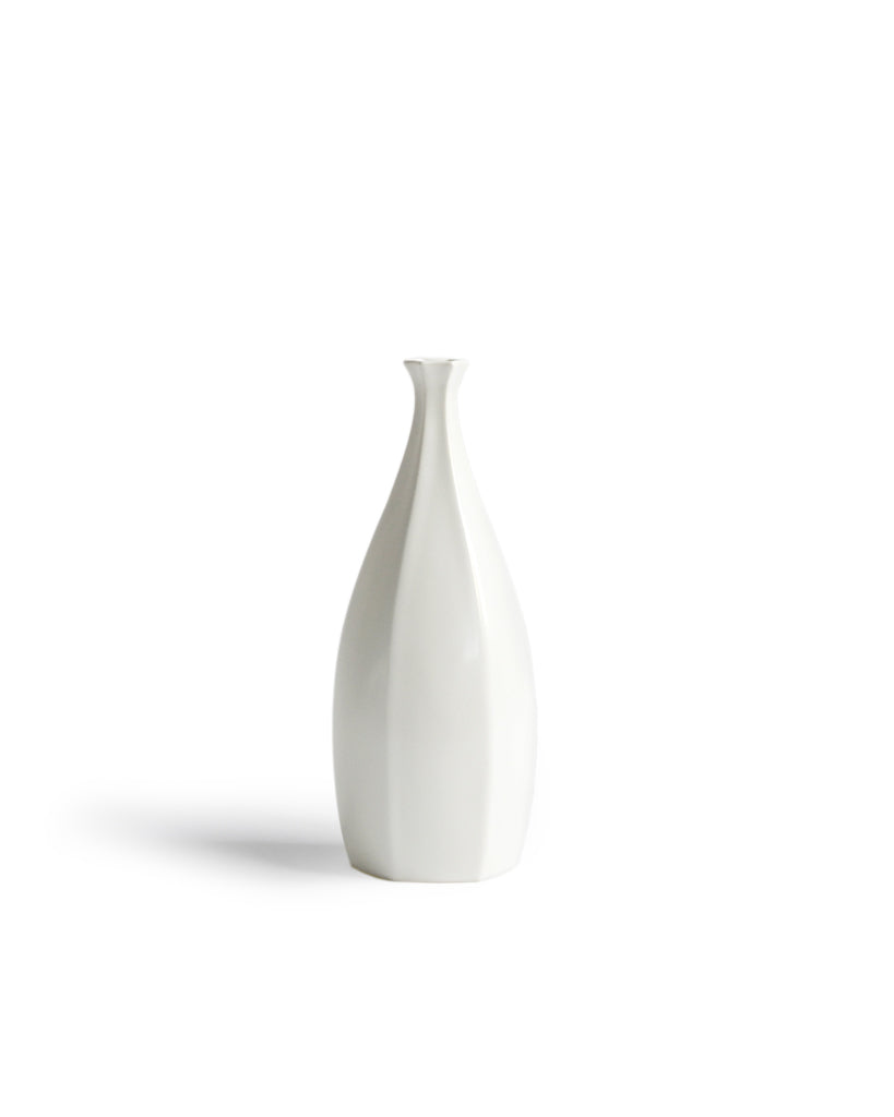 Silhouetted Rokkaku-bin Vase against white background.